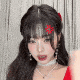 a girl with a red angry face on her head