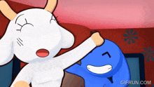 a gif from gifrun.com shows a goat and a blue cartoon character