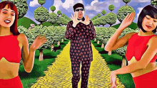 a man in a polka dot suit is dancing with two women