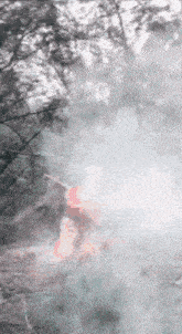 a woman in a red bikini is swimming in a pool of water