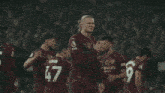 a group of soccer players with one wearing a number 17 jersey
