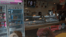 the inside of a bakery with a sign that says ' ice cream ' on it