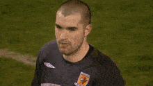 a soccer player wearing a jersey that says tigers
