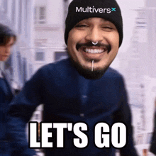 a man with a beard wearing a multivers beanie says let 's go
