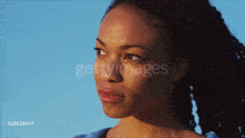 a close up of a woman 's face with the words gettyimages on the bottom right