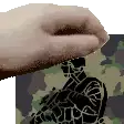 a hand is reaching out towards a soldier in a camouflage uniform with a gun .