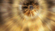 a blurred image of a person 's eye with a glowing center