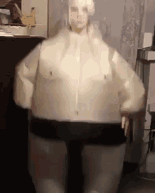 a person is wearing a costume that looks like a sumo wrestler ..