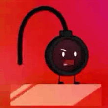 a black cartoon bomb with arms and legs is standing on a table .