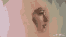 a woman is painting a portrait of a woman 's face with a brush .