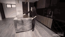 a woman in a kitchen with the words made in animotica on the bottom right