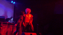 a blurred image of a person dancing in a dark room