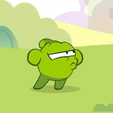 a green cartoon character with a red tongue is standing in a field .