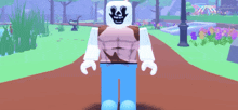 a roblox character with a skull on his face is standing on a path in a park
