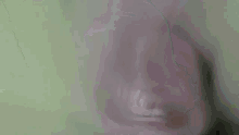 a close up of a person 's face in a dark room