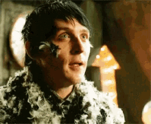 Oswald Chesterfield Cobblepot Covered In Feathers GIF