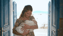 mamma mia donna sheridan holding baby holding a baby mother