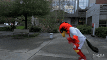 a mascot from seattle university is standing on a sidewalk