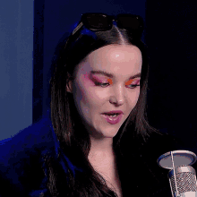 a woman wearing sunglasses with the word gucci on it