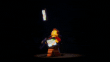 a group of lego figures are holding up a screen that says ' hawky ' on it