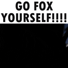 a man in a suit and tie is standing in front of a sign that says " go fox yourself "