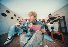 a group of men are playing instruments in a room