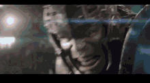 a close up of a superhero 's face with a blurred background