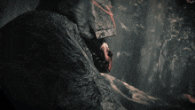 a man with blood on his face is laying down