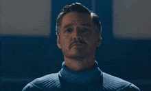 a man in a white sweater holds a clipboard