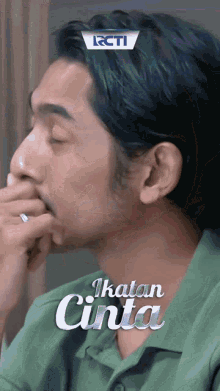 a close up of a man 's face with the words " ikatan cinta " on the bottom