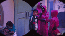 a netflix advertisement shows a group of people in pink jackets