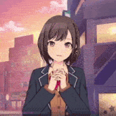 a girl in a school uniform is standing in front of a building with her hands folded