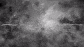 a black and white photo of a cloudy sky with a few stars in it .