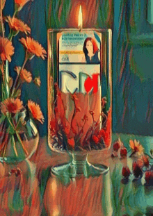 a candle with a picture of a woman on it is on a table