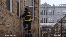 Climbing A Building Chicago Fire GIF - Climbing A Building Chicago Fire Firemen At Work GIFs