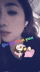 a woman with a monkey laying on a pillow and the words " ijin parkun yaa " written on her face