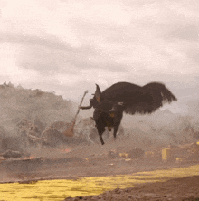 a person with wings is flying over a yellow road