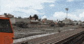 a blurred image of a train track with the gr logo in the upper right corner