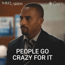 a man in a suit and tie is saying " people go crazy for it "