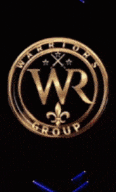 a logo for the warriors group with green lights behind it