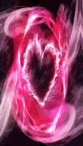 a heart shaped object is surrounded by pink smoke .