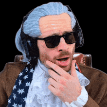 a man wearing a wig sunglasses and headphones is making a funny face