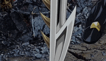 a cartoon drawing of a sword and shield with a black shoe in the background