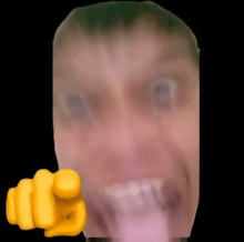 a close up of a person 's face with a yellow fist pointing at it