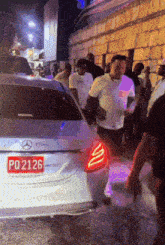 a mercedes with a license plate that says pd 2126