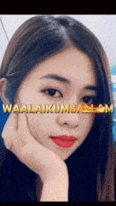 a close up of a woman 's face with waalaikumsalam written in gold