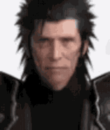 a close up of a man 's face with a black jacket on .
