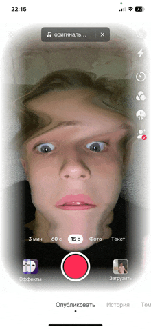 a phone screen shows a video of a person 's face with the time of 22:15