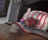 a cartoon character is sleeping in bed with a striped pillow