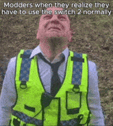 a man in a yellow vest and tie is crying with the caption modders when they realize they have to use the switch normally